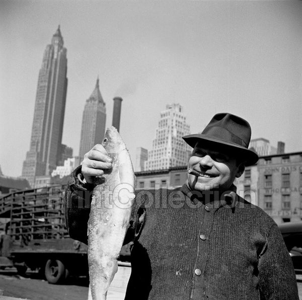 New York, New York. Stevedore Holding Fish